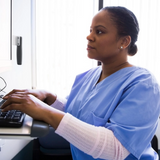 A healthcare provider using a computer