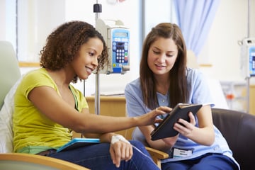 nurse and patient with screen stock medium res